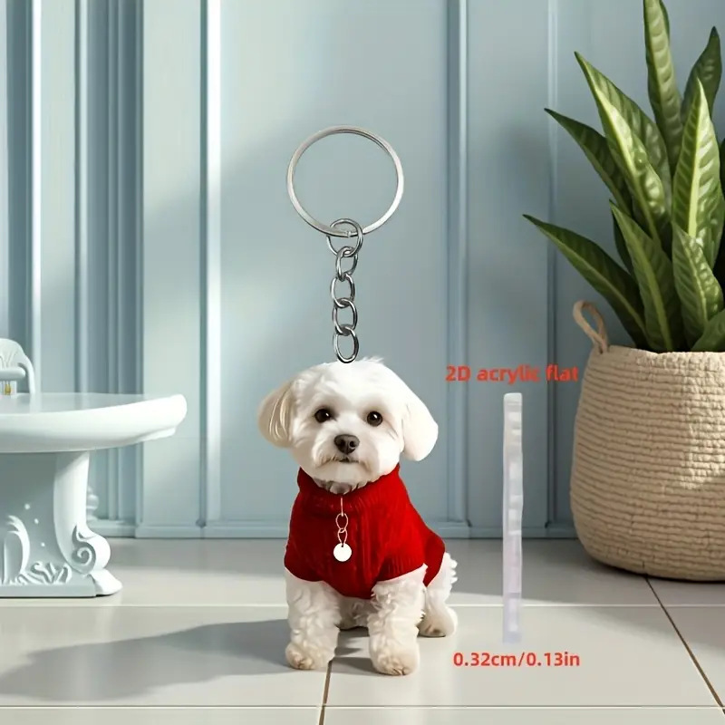 A cute white puppy, wearing a red sweater, as a vinyl hanging keychain A cute white puppy, wearing a red sweater, as a vinyl hanging keychain