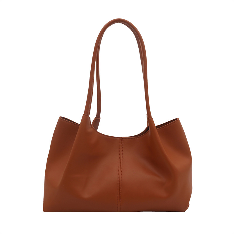 Este año, la sensación de relajación de la moda de color sólido 2024, el nuevo tipo de bolso de hombro simple de gran capacidad, bolso de mano de empalme de moda