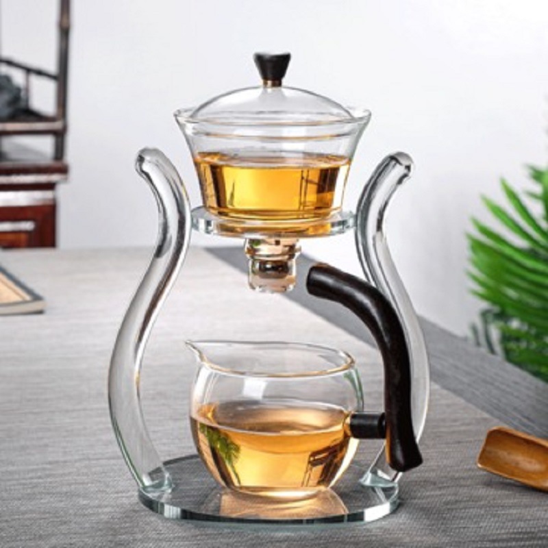 Fábrica al por mayor de vidrio transparente fabricante de té traje de succión magnética juego de té perezoso fabricante de té con soporte Palacio Lámpara juego de té traje