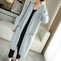 卸売りの新型の中の長いコートの女性のセーターの秋冬のニットの外は純色の長袖の外を着て膝のカーディガンをオーバーします。