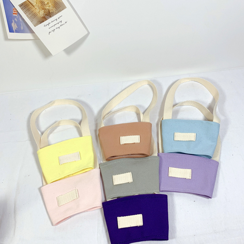 Fábrica al por mayor color sólido leche taza de té cubierta lona embalaje bebidas portátil bolso café taza mano