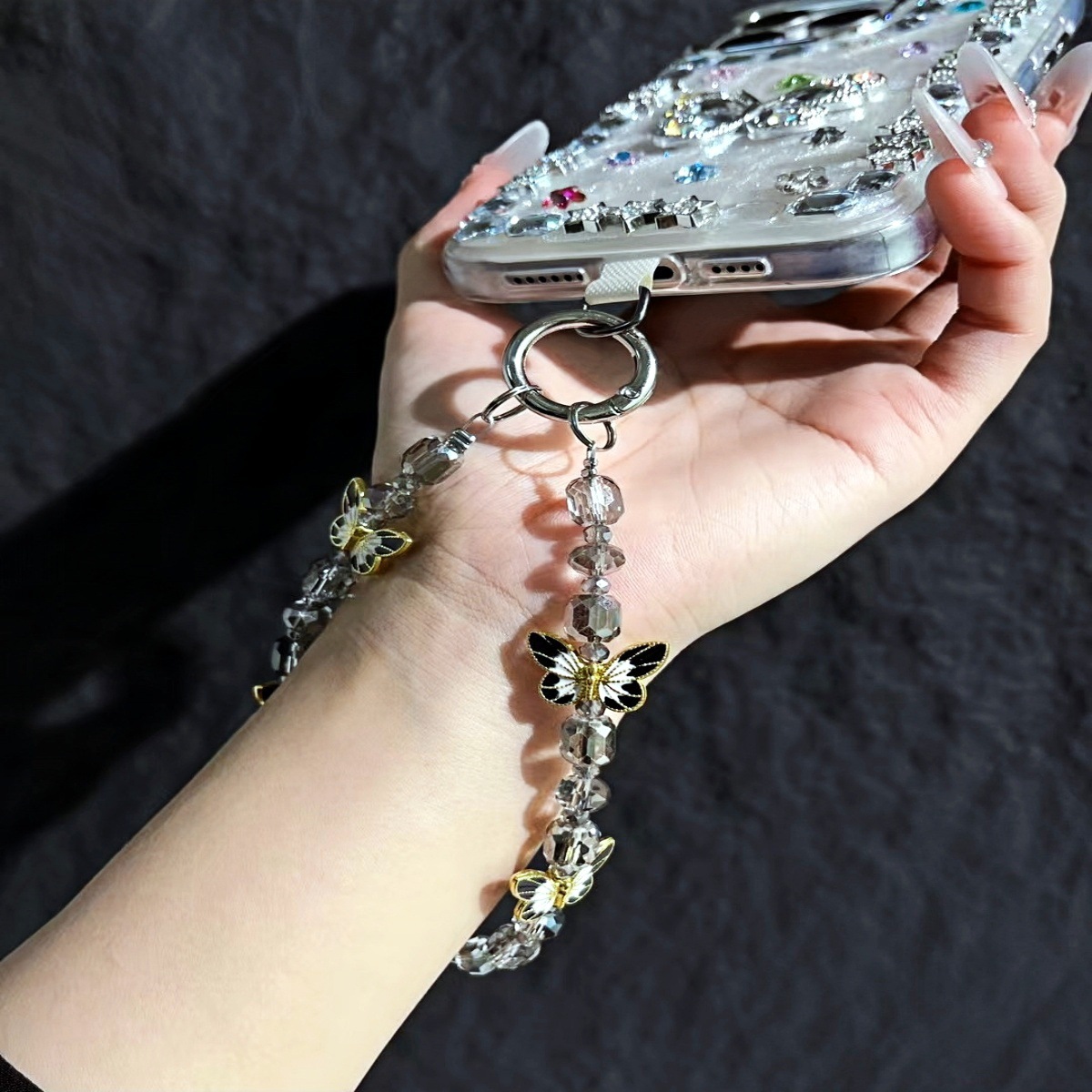 Cadena de teléfono móvil al por mayor cadena de cuentas de cristal flor de mariposa sentido de alta gama cadena corta hecha a mano para mujer bolsa de viento NIS todo fósforo