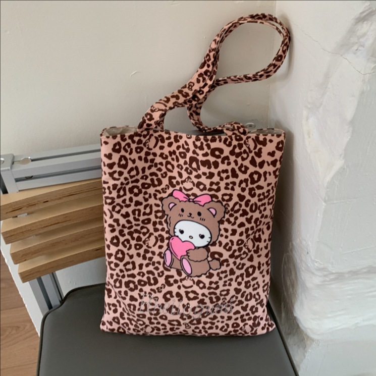 Bolsa de moda de balde, bolso de lona universal, mujer, otoño y invierno 2025, nuevo modelo de bolso de hombro con patrón de leopardo, bolso de brazo de viaje