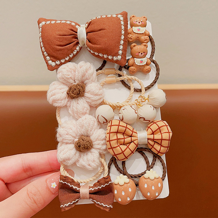 La banda de goma de la flor marrón de la leche de las muchachas de la venda de los niños no lastima el pelo banda elástica alta del pelo de la cola de caballo