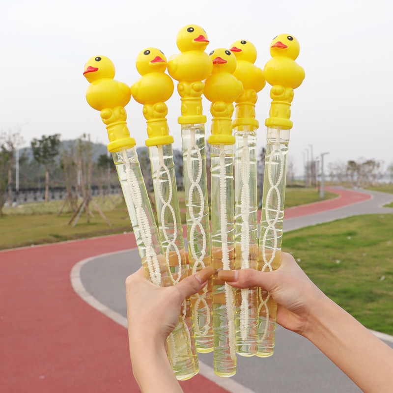 Máquina de burbujas en forma de patito amarillo – varita de burbujas recargable con líquido, juguete infantil al por mayor