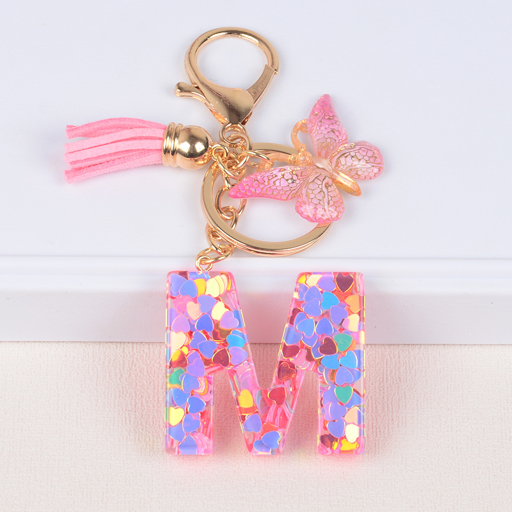 Explosiones transfronterizas amor sequillas iniciales llavero al por mayor resina letra mariposa fringe llavero se puede personalizar