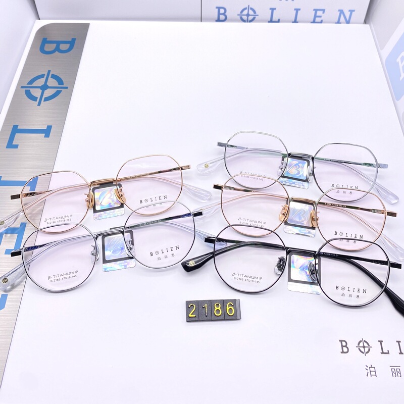 Wholesale 2186 fashion ultra light high quality semi titanium glasses frame ceramic nose support super elastic temple is not easy to decolorization