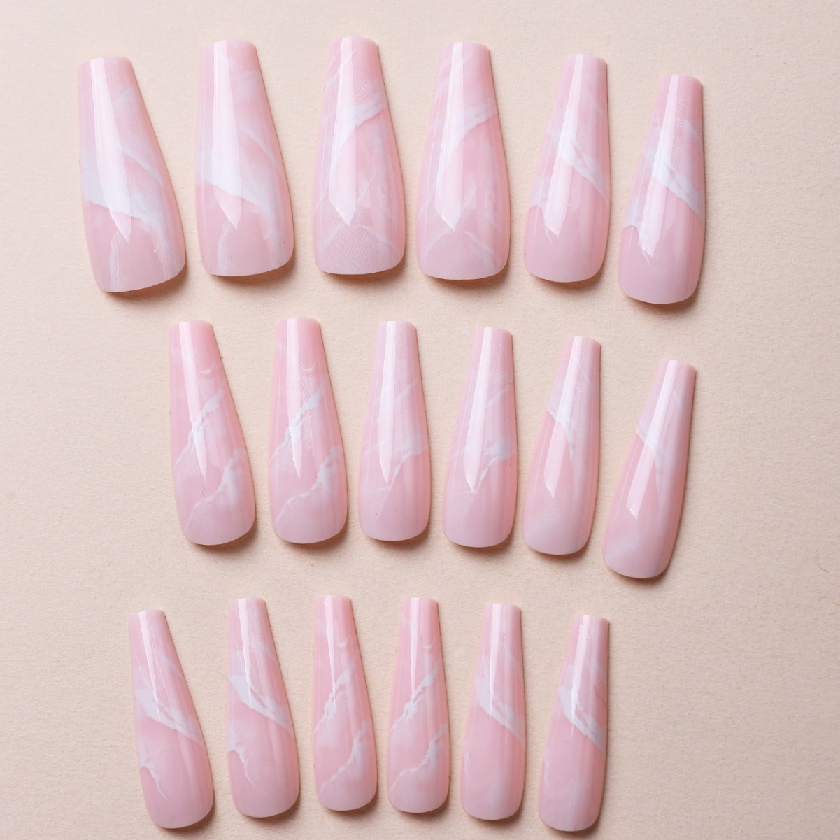 Millones de puntos venta directa patrón de mármol transfronterizo armadura portátil rosa manicura falsa armadura portátil desmontable de longitud media