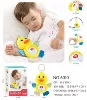 Appeases doll with light music, duck