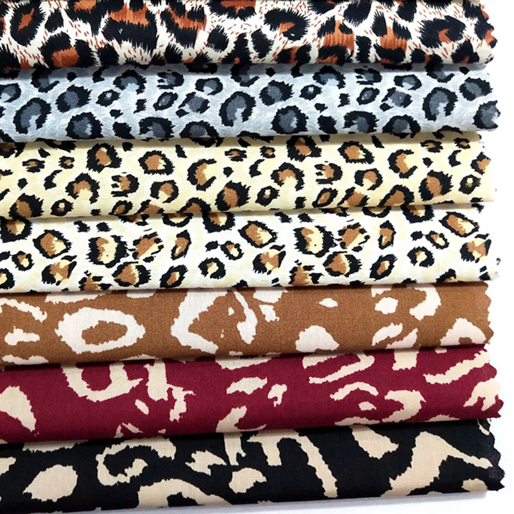 Inventario de alta calidad impresión de leopardo amarillo negro 100 algodón tela de ropa de seda