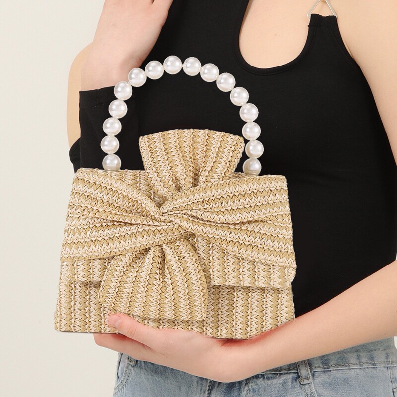 Cross-Border European and American Spring and Summer Design Pearl Handbag, Fashionable and Versatile Handmade Bow Women's Woven Straw Bag