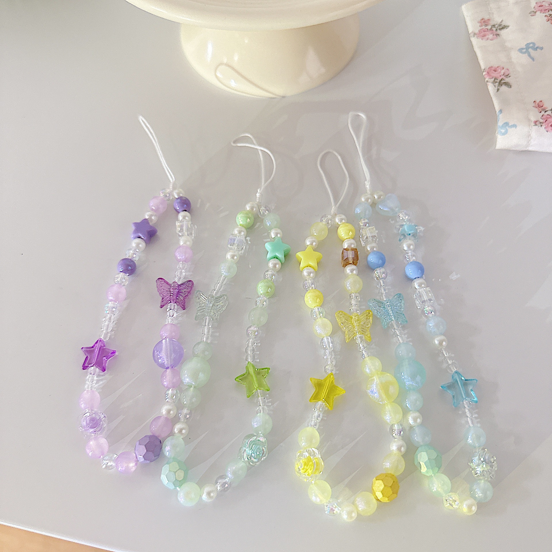 Cadena aplicable nicho mariposa corta cadena de muñeca arco cuentas de caso de teléfono móvil colgante tipo correa de muñeca anti-pérdida