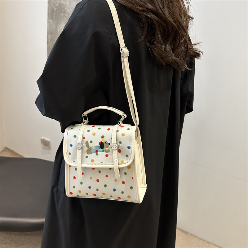 Cute bolso de mujer de dibujos animados 2024 nuevo estilo versátil texturas de estilo de viaje simple mochila de estilo universitario