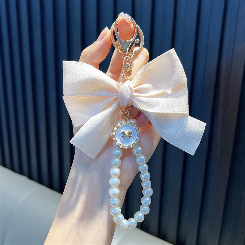 Perlas hechas a mano llaveros de perlas mujeres arco de correa de color bolsos colgantes pequeños regalos al por mayor