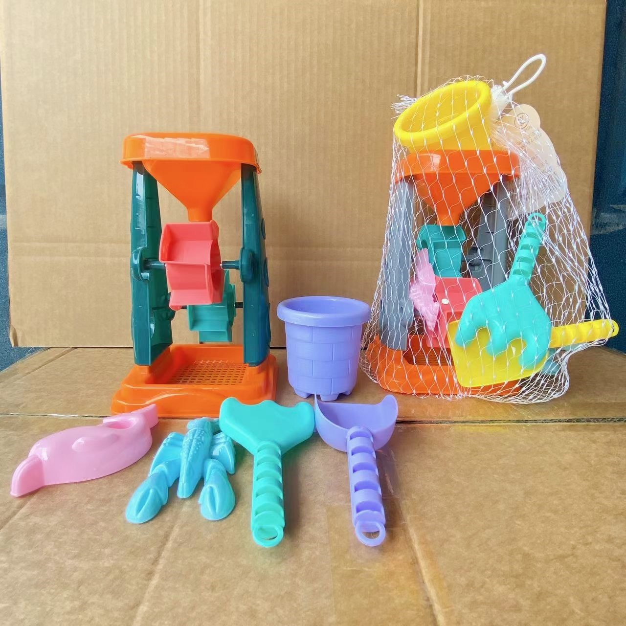 Juguetes de arena para niños reloj de arena pequeña pala juguetes de playa conjunto de seis piezas traje juguetes de agua 2 yuanes grandes almacenes al por mayor