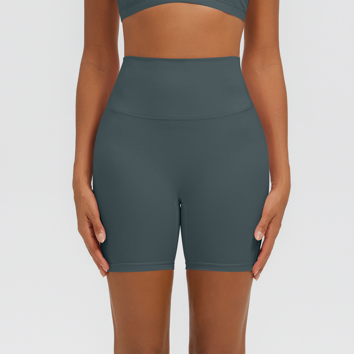 Nuevo tipo delgado de hielo, piel transpirable, ajustado, color sólido, ropa de yoga, pantalones cortos de tres puntos.