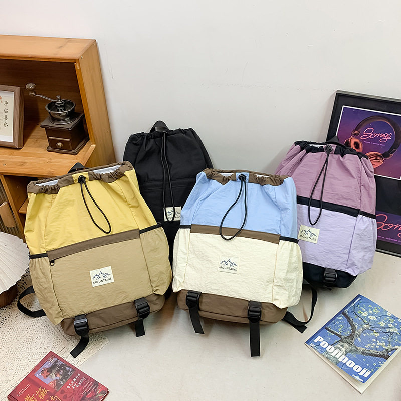 Mochila de moda coreana para niños y niñas, mochila de gran capacidad para estudiantes de escuela primaria, nueva mochila para niños con cuerda extranjera.