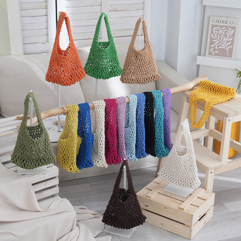 2026 New Korean-Style Niche Hollow-Out Mesh Clutch Woven Wrist Bag Fashionable Beach Vacation Handbag 2026 New Korean-Style Niche Hollow-Out Mesh Clutch Woven Wrist Bag Fashionable Beach Vacation Handbag