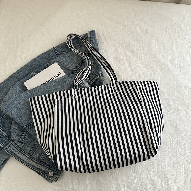 Bolsas de lona a rayas de otoño de mujeres bolsas 2024 nuevas bolsas de mano populares bolsas de hombro casuales de gran capacidad bolsas tote