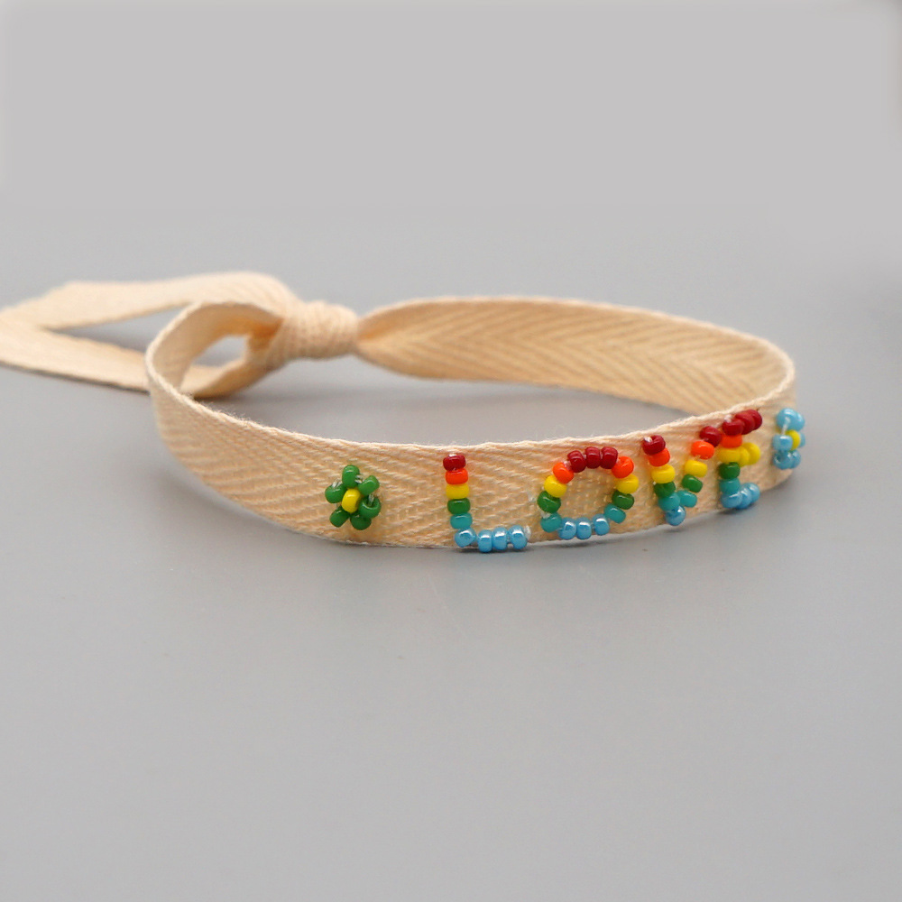 Bohemian Ribbon Rice Bead Woven Rainbow Letter Bracelet display picture 4