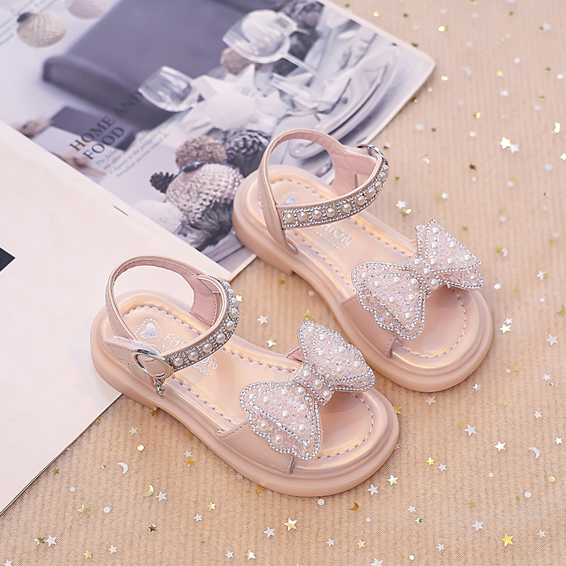 Niños verano 2026 nuevas sandalias de niñas arco brillante con base suave princesa sandalias de viento para niñas sandalias