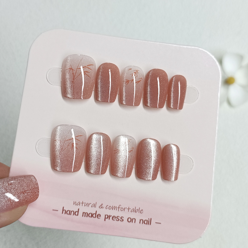 Nuevas puntas de uñas hechas a mano de estilo chino, juego de diez piezas de cristal ojo de gato para decoración de uñas, pegatinas cortas de bambú rojo ojo de gato para uñas.