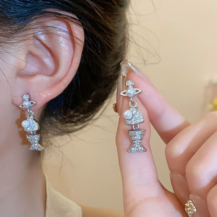 Pendientes de flor de lazo elegante de súper hada de plata Pendientes de moda de lujo ligero francés Pendientes de todo fósforo dulce de estilo literario