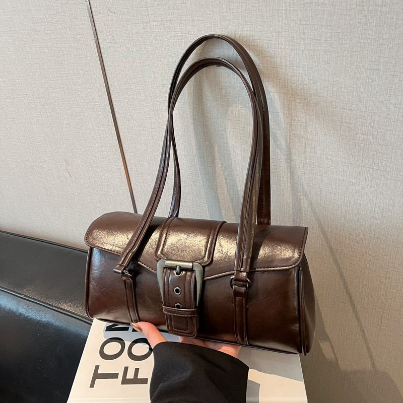 Nicho de alto nivel lujoso hombro bajo la braza bolsa de locomotora 2025 nuevo retro viaje bolso de palo de mujer