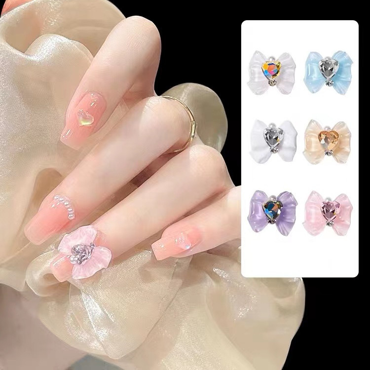 White nail decoration with bow