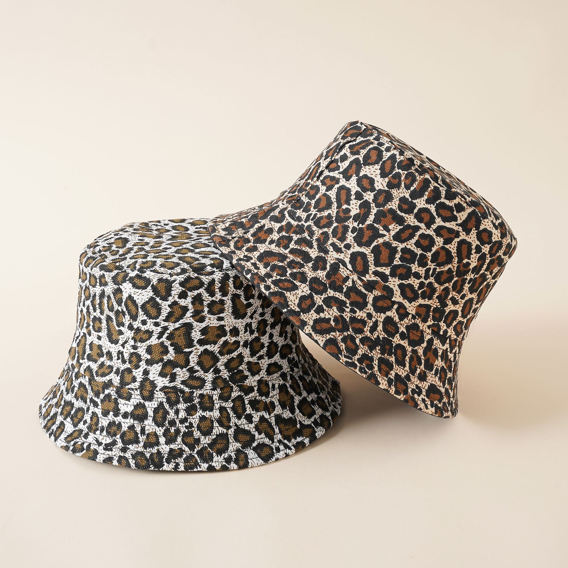 Sombrero de pescador de nicho de las mujeres de estilo coreano de moda Leopardo de doble cara sombrero primavera y verano pescador sombrero
