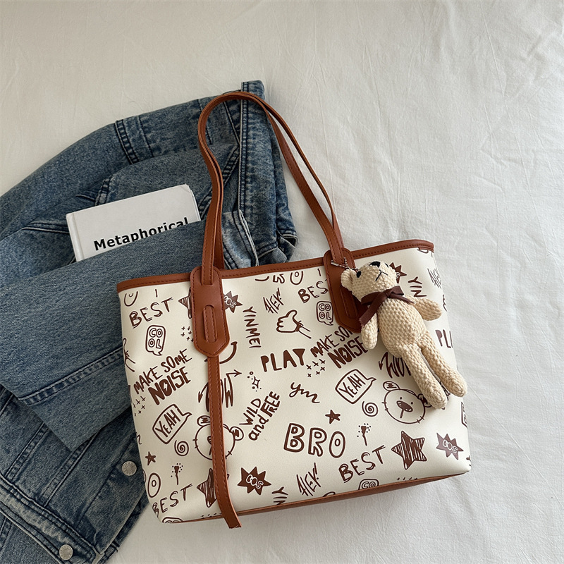 Bolsa de hombro de gran capacidad para mujeres, bolso de alta calidad, bolso grande, 2024 nuevo estilo de moda, bolso de clase de graffiti