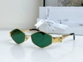 Gold frame, green lens