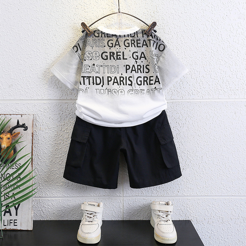 7147 Traje de verano para niños Traje de dos piezas de verano para niños de manga corta casual de Internet rojo bebé de moda de moda nueva 2025