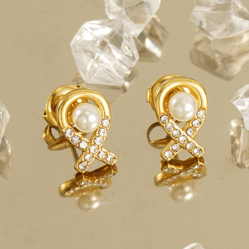 Pendientes de perlas elegantes simples de acero inoxidable 18K para mujeres pendientes de aviones tridimensionales de diamante de acero de titanio de moda de estilo europeo y americano