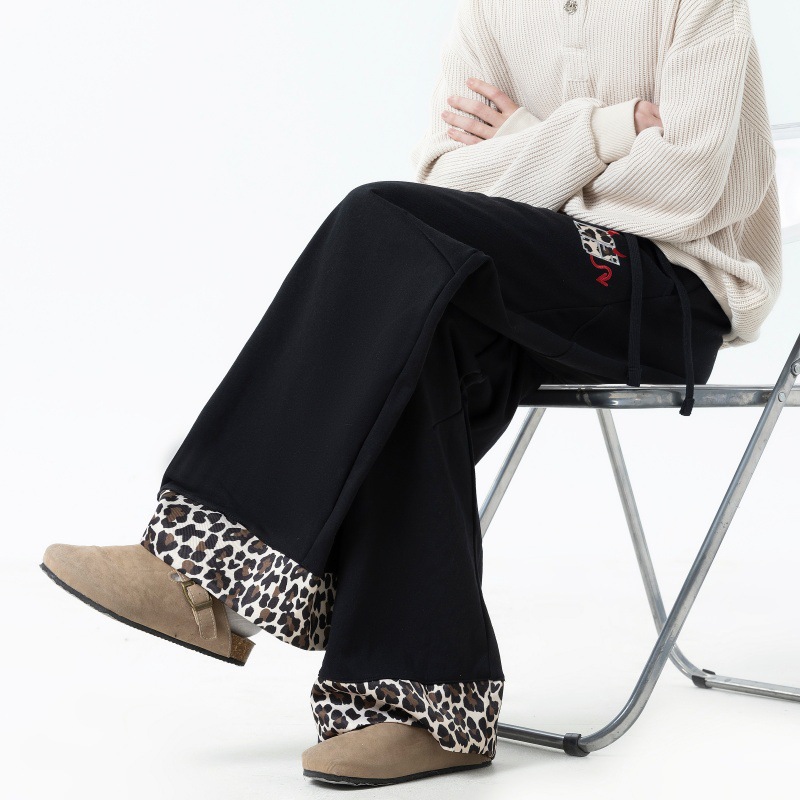 Pantalones casuales para hombres primavera y otoño de 2025 pantalones sueltos de piernas anchas de leopardo para hombres pantalones deportivos de tendencia para hombres