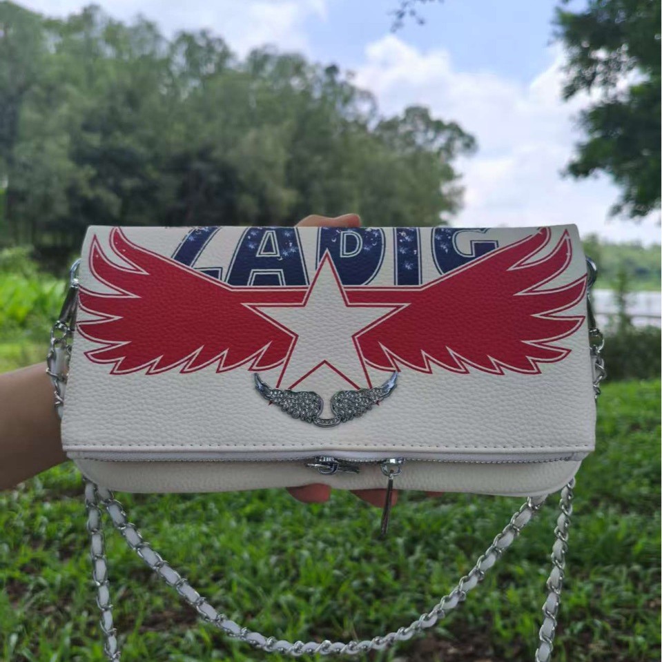 zv transfronterizo impresión inglesa damas de cuero PU cremallera larga multi-tarjeta de mano para llevar dinero brazo de ala taladro caliente