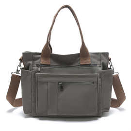 跨境新款单肩斜挎包大容量女通勤轻便休闲情侣运动包多口袋手提包