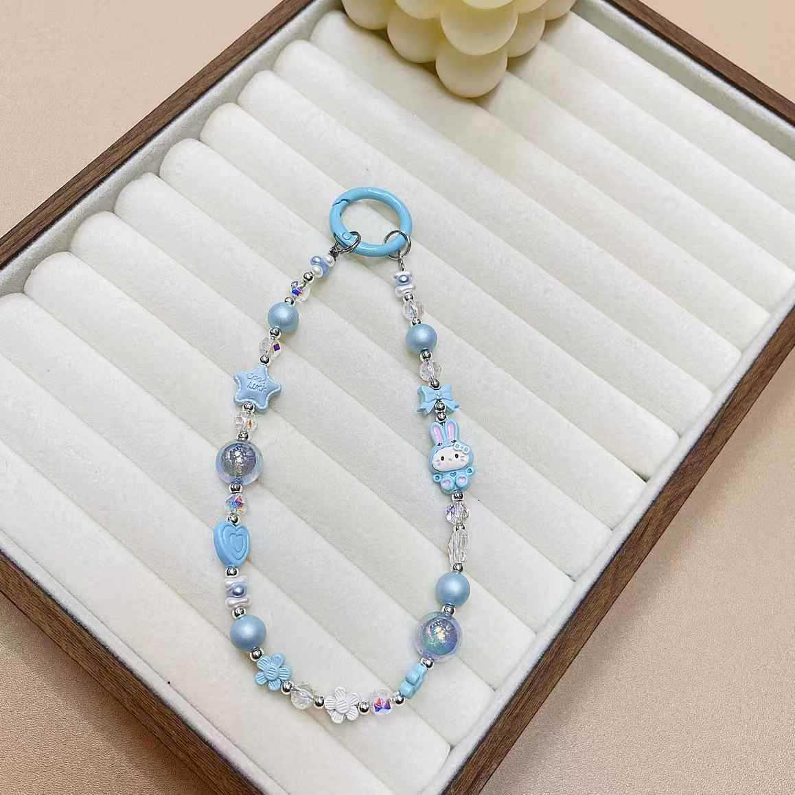 Creativo de dibujos animados KT conejo aleación cadena teléfono móvil cordón muñeca nuevo DIY hecho a mano cuentas estrella de cristal colgante de equipaje