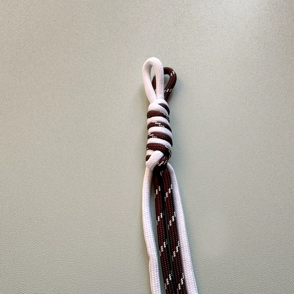E15 knot dark brown with white