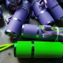 9LED带皮套手电筒户外照明灯批发塑料手电筒3节7号电池橡胶手电筒