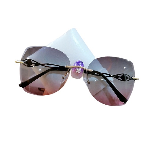 Aoran frameless edge-cut trendy cat-eye sunglasses, personalized metal marine sunglasses, fashion street photography ins glasses