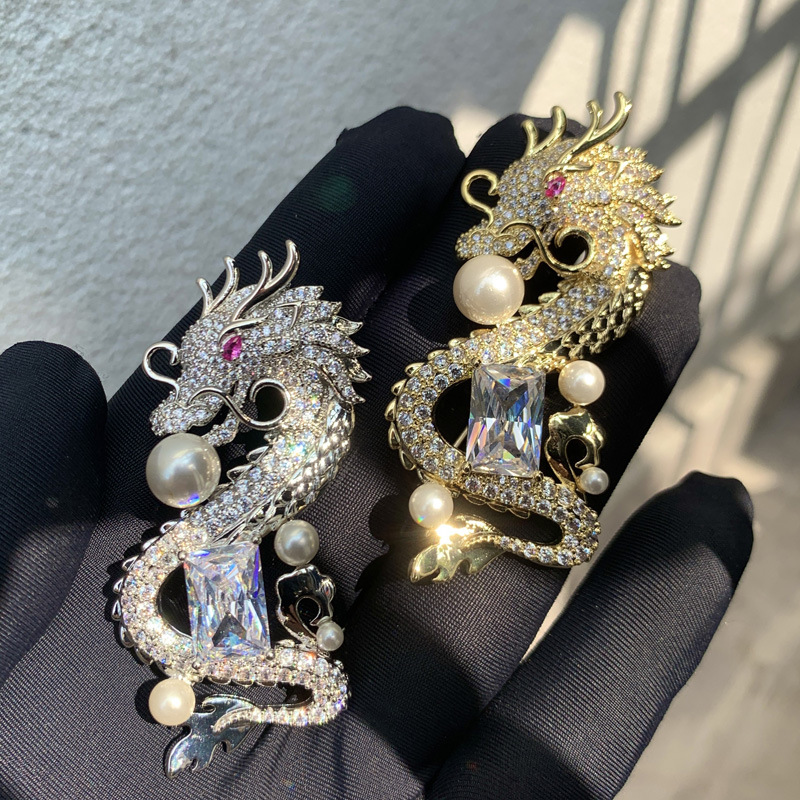 Copper brooch with zircon