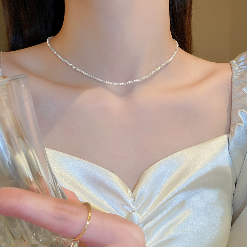 Collar de perlas con lazo de flor con cuentas francesas Elegante cadena de clavícula con sentido de alta gama retro ligero decoración de lujo femenino