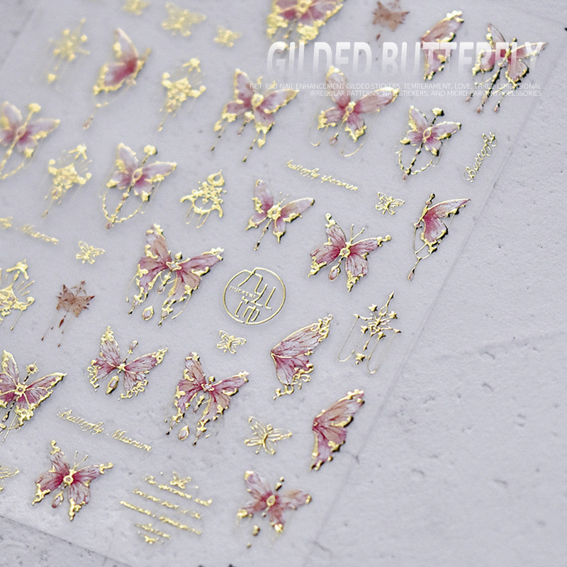 Pegatinas de uñas doradas populares pegatinas de uñas lindas japonesas alivio de fábrica mariposa tridimensional Shell luz Rosa mariposa al por mayor