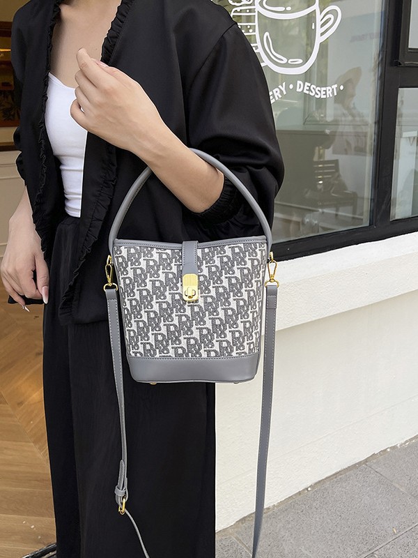 Bolso de mano exquisito de alta gama para mujer 2025 nuevo bolso de cubo retro con estampado de tela bolsa de mensajero de un solo hombro de nicho