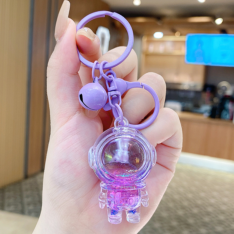 Caricatura en aceite líquido arena flotante botella mochila llavero delicado colgante accesorios accesorios máquina de muñecas pequeños regalos al por mayor