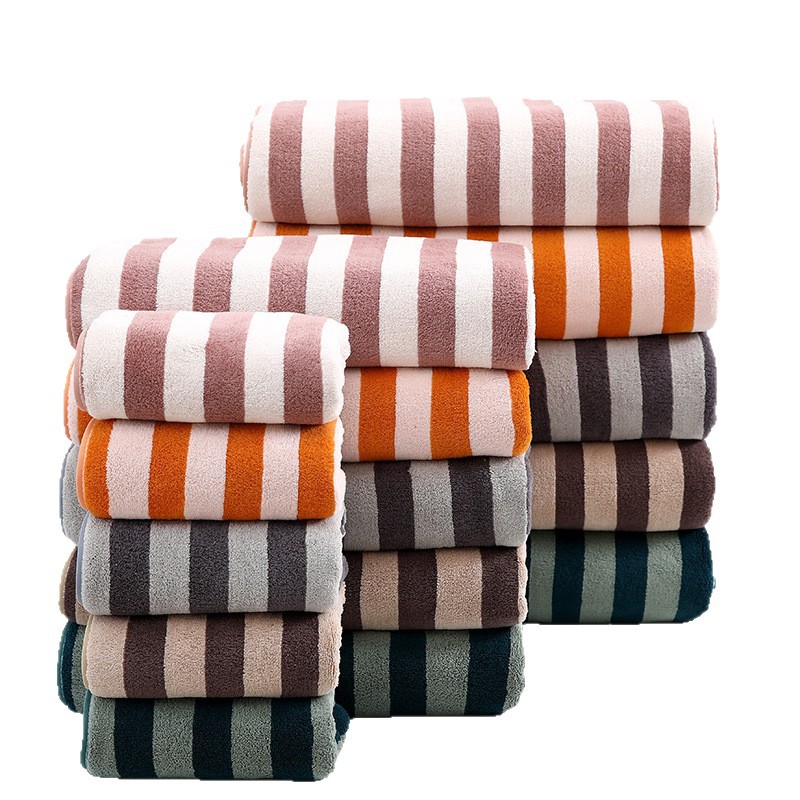 Toallas anchas al por mayor engrosadas absorción suave envueltas cuerpo grande toalla de baño de urdimbre simple toalla de baño de lana de coral