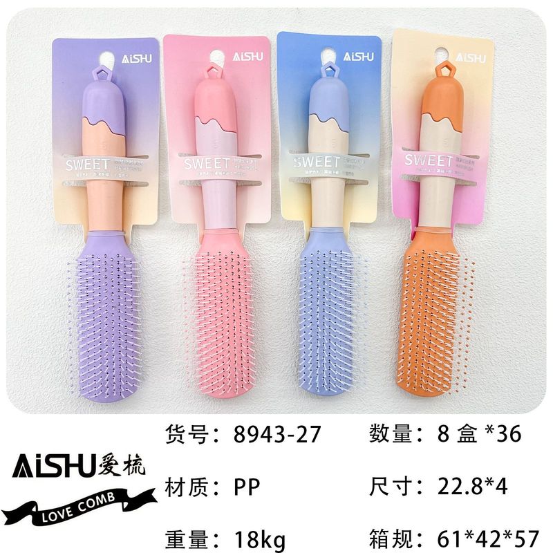 新商品のキャンディー色のクッションマッサージ櫛の半円の頭がふわふわしています。|undefined
