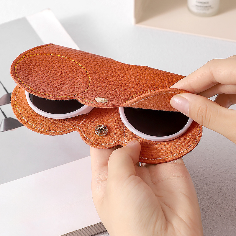 Nuevo paquete de gafas de sol portátiles bolsa de almacenamiento de gafas de sol estuche de gafas con patrón de lichi cuello colgante gafas de cuero cubierta protectora