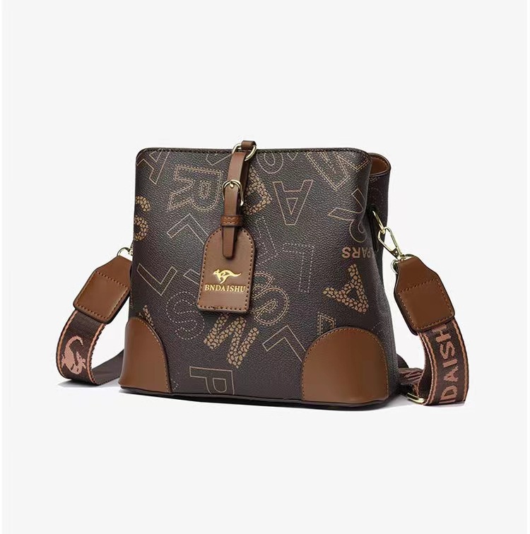 Bolso de cubo de sensación de alta gama para mujer 2025 verano nuevo bolso de hombro clásico de todo fósforo diseño de nicho bolso de mensajero portátil